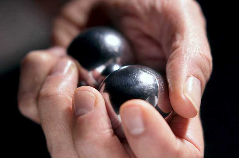 C42-Hand-holding-two-steel-balls.jpg